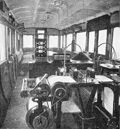 Recording instruments of various kinds were carried inside the dynamometer car. In the foreground of this picture is the machine for recording the drawbar pull of the locomotive, which is marked on the roll by one of the nine pens in the centre of the table. In the background is seen the apparatus for analysing the gases in the smoke-box of the engine.